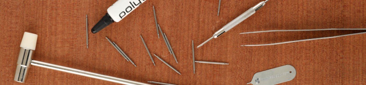 watch tools on a wood background