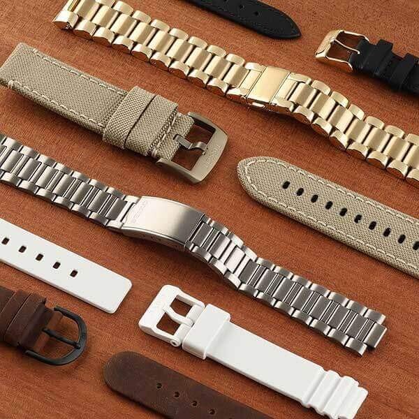 watch bracelets on a wood background